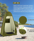 Olive green Pop Up Privacy Shower Tent With Windows For Camping And Bathroom Breaks, Portable Changing Shelter shown by the beach.