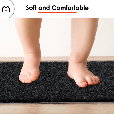 Child's feet on Non Slip Stair Treads For Wood Steps Peel And Stick 8x30 Inch Runner Rug Black 15 Pack Kid Friendly Pet Safe