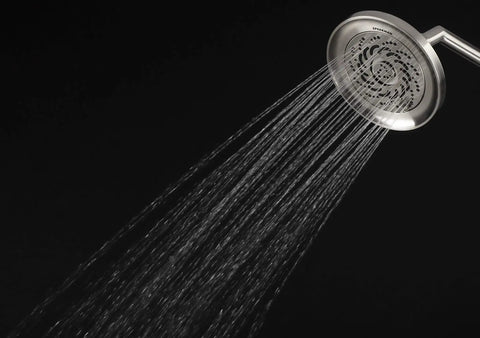 Kubos Exhilaration High Pressure Handheld Shower Head Matte Black Finish, 2 GPM, water flow from round showerhead on black background