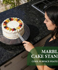 16 Inch Natural Rosso Luana Marble Lazy Susan Cabinet Turntable displaying a cake being cut on a kitchen counter.