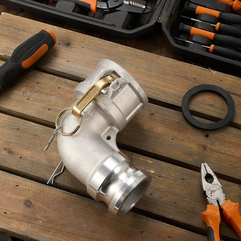 Aluminum Cam and Groove Hose Fitting 2 Inch Female to 2 Inch Male 90 Degree Elbow Camlock on wooden surface