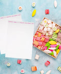 100 Count Clear Self Sealing Cookie Bags With Individual Packaging shown with colorful candies on a blue surface