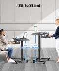 Mobile Standing Desk With Keyboard Tray And Wheels, Gas Spring Lift from 28.3 to 44 inches, in use by seated and standing people.