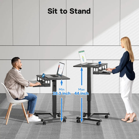 Mobile Standing Desk With Keyboard Tray And Wheels, Gas Spring Lift from 28.3 to 44 inches, in use by seated and standing people.