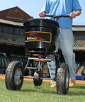 Heavy-Duty Push Spreader With Side Deflector Kit And Hopper Grate For Lawn Care, 50 lb capacity on grass, black finish
