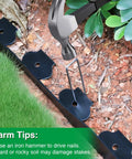 1.5 Inch Landscape Edging Kit With 100 Feet Total No Dig Lawn Border installation using hammer and spikes in garden