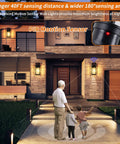 Family in front of house lit by 2 Pack Motion Sensor Outdoor Wall Lights Dusk To Dawn Matte Black Porch Lanterns for exterior garage and patio.