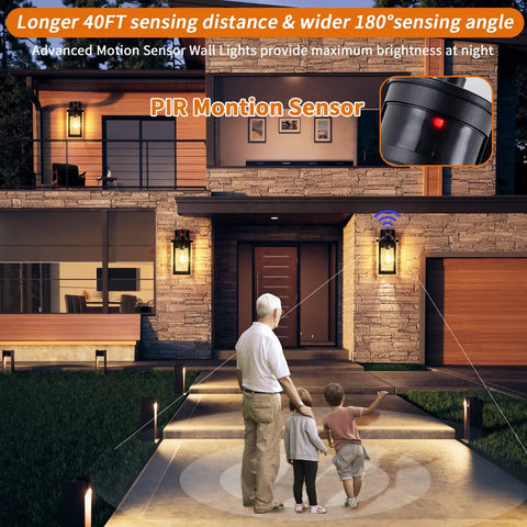 Family in front of house lit by 2 Pack Motion Sensor Outdoor Wall Lights Dusk To Dawn Matte Black Porch Lanterns for exterior garage and patio.