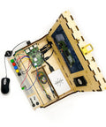 Hands-On Kids Computer Kit For STEAM Learning With Raspberry Pi, Drag-And-Drop Coding, Story Mode, Python Projects, Interactive Games, And Real World Tech Skills open wooden case with screen, speaker, and wires
