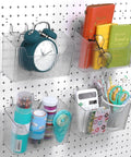 Sweet 4 Piece Pegboard Bins Set With Metal Hooks For Garage Organization Clear Plastic Bins Keep Tools Neatly Stashed And Within Reach On Your Workbench 7.9 By 3.3 By 4.7 Inches, displaying assorted stationery items.