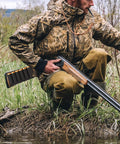 Hunter with shotgun featuring 8 Round Tactical Shotgun Shell Holder for Buttstock 12 Gauge 20 Gauge Ammo Carrier outdoors