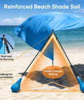 Beach Shade Canopy 100 Sq Ft Wind Powered Sunshade Sail For 4 To 6 People with sandbags on a beach
