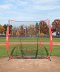 7x7 Ft Baseball And Softball Practice Net set up on a baseball field with a backstop design for hitting and pitching practice.