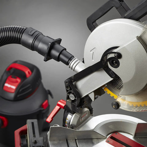 Universal Tool Adapter For Dust Collection Hoses Cut To Fit installed on a power tool in a workshop setup