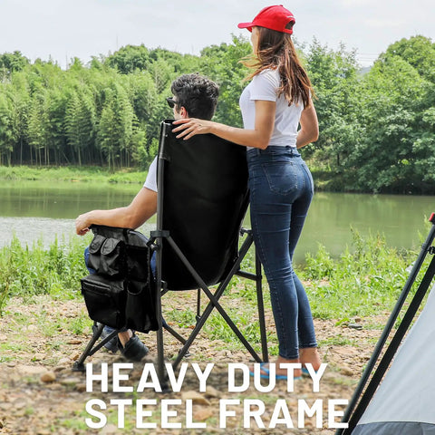 Two people by a lake using Oversized Folding Camping Chair With High Back Support 500 Lbs Capacity Extra Wide Seat.
