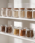 Clear Acrylic Shelf Dividers For Closet Organization 6 Pack Adjustable supporting jars of grains and spices on a pantry shelf.