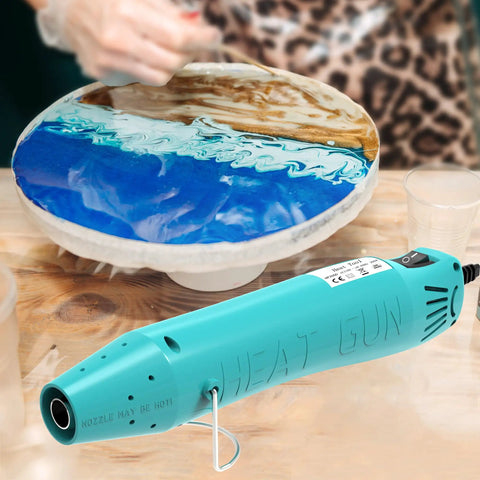 Mini 300W Heat Gun For Shrink Tubing And DIY Crafts With Reflector Nozzle A Versatile Shrink Wrap Gun Tool For Packaging PVC Drying Paint And Clay Green in use on pottery wheel
