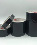 Straight Up Black Engineer Grade Reflective Tape That Goes Hard On Worksite Safety For Pipes And Bollards Smooth Flat Or Round Surfaces With Peel Off Acrylic Backing rolls displayed on a white background.
