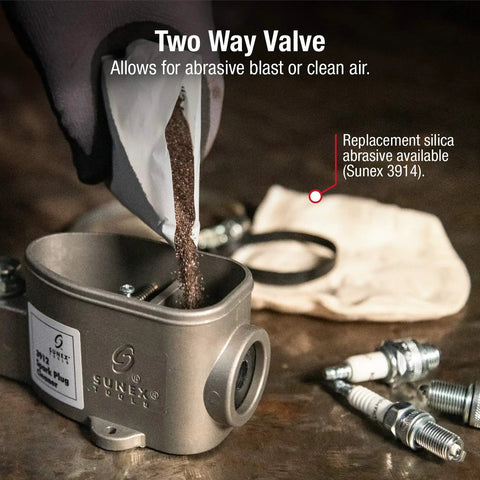 Spark Plug Cleaner With Two Way Valve For Abrasive Blast Or Clean Air Compact Auto Shop Tool being refilled with silica