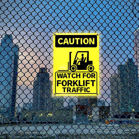 3 Pack Watch For Forklift Traffic Safety Signs 10x14 Aluminum, Caution Yellow Black Signs on a chain-link fence in an urban setting