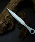 Kunai Inspired Throwing Tool With Full Tang Stainless Steel Build on wooden background