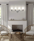 4 Light Chrome Vanity Fixture With Double Layer Anti Glare Glass Shades installed above a living room fireplace.