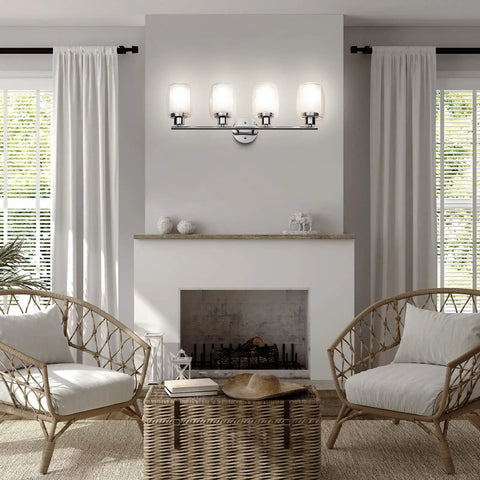 4 Light Chrome Vanity Fixture With Double Layer Anti Glare Glass Shades installed above a living room fireplace.