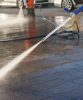 High Pressure Washer Wand With Adjustable Spray Tips for car wash and home cleanup, universal connector in use on driveway