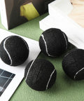 40 Pack Precut Tennis Balls For Furniture Legs And Floor Protection, Easy Slip-On Chair Foot Covers, black, on table
