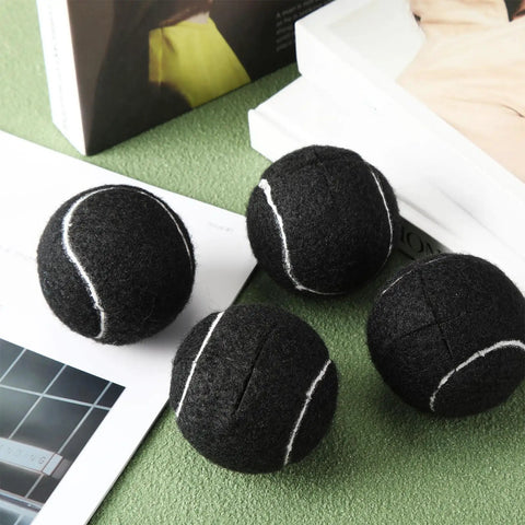 40 Pack Precut Tennis Balls For Furniture Legs And Floor Protection, Easy Slip-On Chair Foot Covers, black, on table