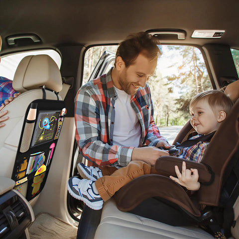 Father with toddler in car seat, showing backseat car organizer with 8 large pockets and tablet holder for kids and toddlers.