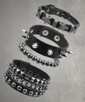 Set Of Four Badass Punk Studded Leather Bracelets For Men And Women Adjustable Spike Rock Goth Emo Y2K Grunge Wrist Cuffs on display.
