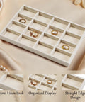 Totally Sweet Beige Linen Jewelry Display Tray With Sixteen Grid Slots For Rings Necklaces And Bracelets Ultra Soft Fabric Organizer on satin fabric.