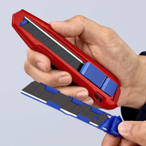 CutiX Universal Snap Knife With Stabilization Bar, 6-1/2 Inch Red Blue Grip in hand, showcasing quick blade change
