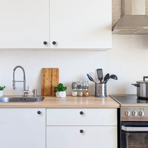 Ten Pack One And One Quarter Inch Matte Black Round Cabinet Knobs Zinc Solid Drawer Pulls For Cabinets Cupboards Dresser Closet And Bathroom Modern Hardware For Kitchen And Furniture Durable Rust Resistant installed on white kitchen cabinets