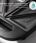 Ovente Electric Sandwich Maker With Quick Heating Non Stick Plates For Toasting Paninis And Omelets Perfect Hot Pressed Breakfast Grill Machine In Sleek Black Finish showing PFAS-free ceramic cooking surface.