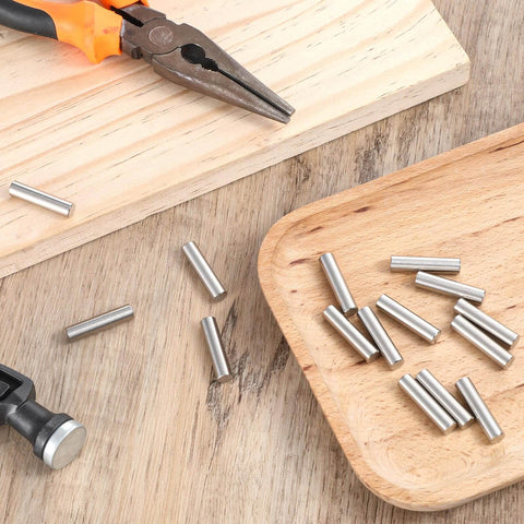 15 Pack One Quarter Inch Stainless Steel Shelf Peg Pins With Chamfered Ends For Easy Insertion, on wooden surface