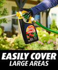 Person using Ready To Spray Hose End Lawn And Landscape Fire Ant Killer Kills Fire Ants Fleas And American Dog Ticks 32 oz