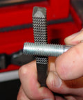 Close-up of Pro Grade 20-Piece Spindle Thread Restorer Die Set tool in use on metal threads