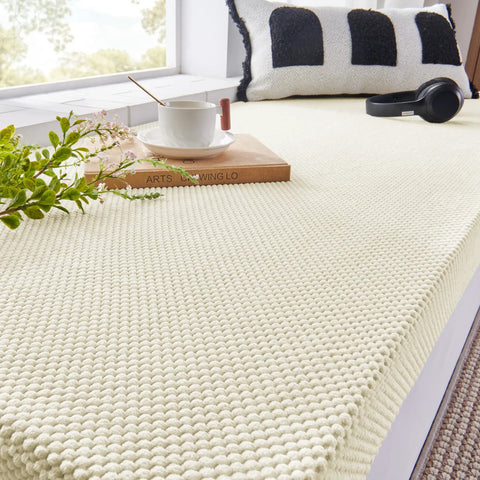 Custom Fit Fireplace Hearth Pad Big Time Ultra Snug Corduroy Baby Proof Buffer Bumper Non Slip Window Seat Cover on a window seat.