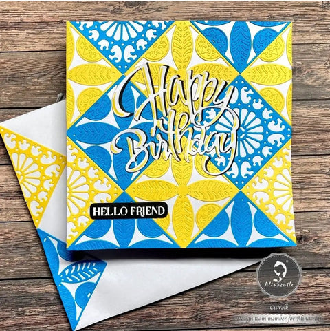 Colorful handmade birthday card with intricate blue and yellow patterns on wooden background, featuring 'Happy Birthday' text.