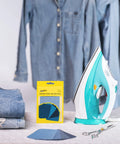 Denim Iron-On Patch Kit With 12 Patches In Three Blue Shades For Inside And Outside Glue Durable Repair For Jeans And Jackets Three Inch By Four And A Quarter Inch Easy DIY Embellishment To Patch Holes And Level Up Your Style. Iron-on denim patch kit with 12 blue patches, folded jeans, and iron