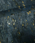 Top Shelf Natural Cork Wall Covering In Dope Navy Blue With Shiny Gold Metallic Vibes texture close-up, highlighting gold flecks.