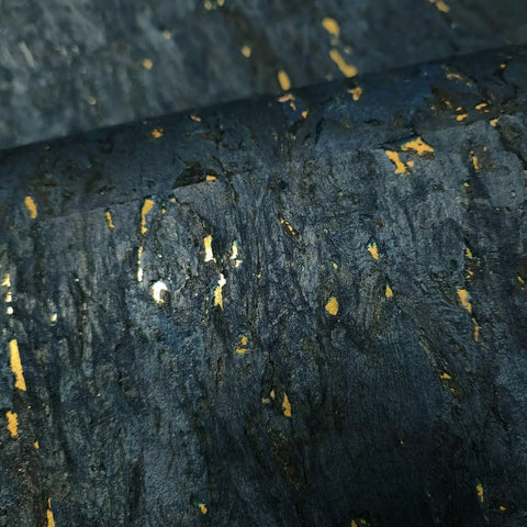 Top Shelf Natural Cork Wall Covering In Dope Navy Blue With Shiny Gold Metallic Vibes texture close-up, highlighting gold flecks.