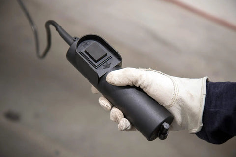 Gloved hand holding remote control for Heavy Duty Electric Hoist With Remote Control And Automatic Braking 850 Watt Motor 39 Foot Cable
