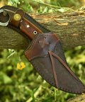 Handmade Damascus Steel Curved Fixed Blade Hunting Knife Nine Inch With Wooden Handle Ring Pommel Leather Sheath on log