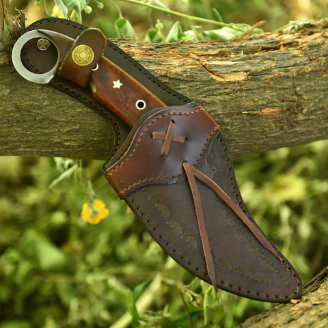 Handmade Damascus Steel Curved Fixed Blade Hunting Knife Nine Inch With Wooden Handle Ring Pommel Leather Sheath on log