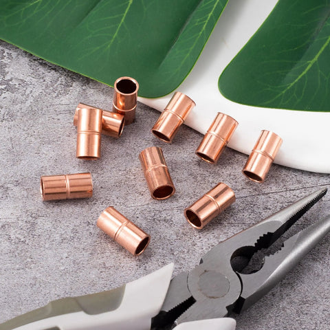 Close-up of 10 copper straight coupling fittings, 1/4 in ID, rolled-end sweat joints for HVAC