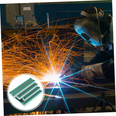 Welding sparks with close-up of Double Sided Breadboard Kit For Soldering Projects, Compact PCB Board For DIY Prototyping and Maintenance.