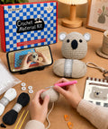 Person using Beginner Crochet Kit For Amigurumi Lovers, All In One Starter Set With Yarn, Crochet Hook, making a koala.